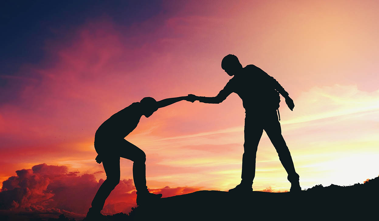 a-person-helping-another-person